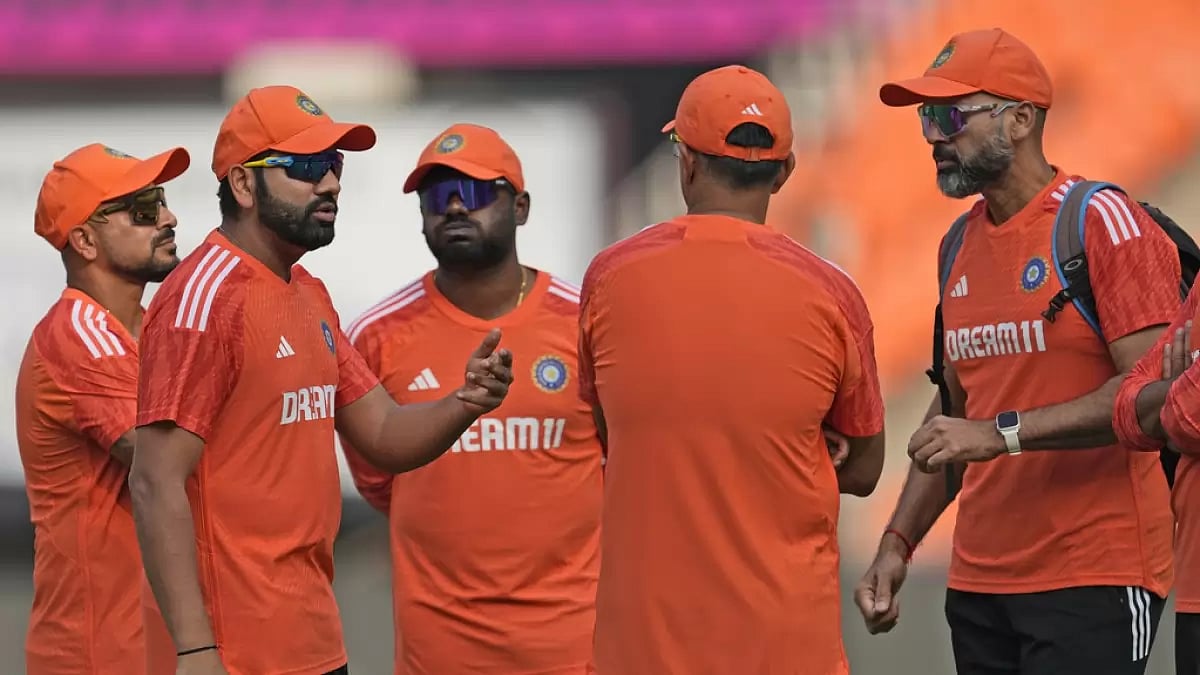 Indian men's cricket team's captain Rohit Sharma discussing something with coach and support staff