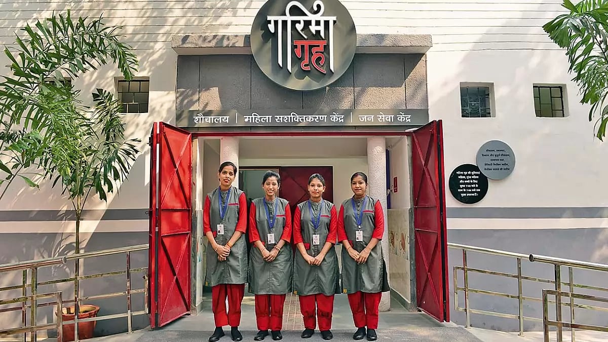 Sanitation attendants of Garima Grih display their pink uniforms designed by National Institute of Fashion Designing
