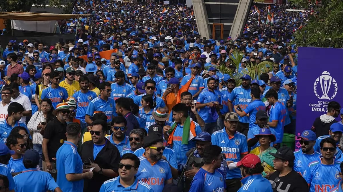 Cricket fans arrive at the Narendra Modi Stadium to watch the World Cup final match in Ahmedabad