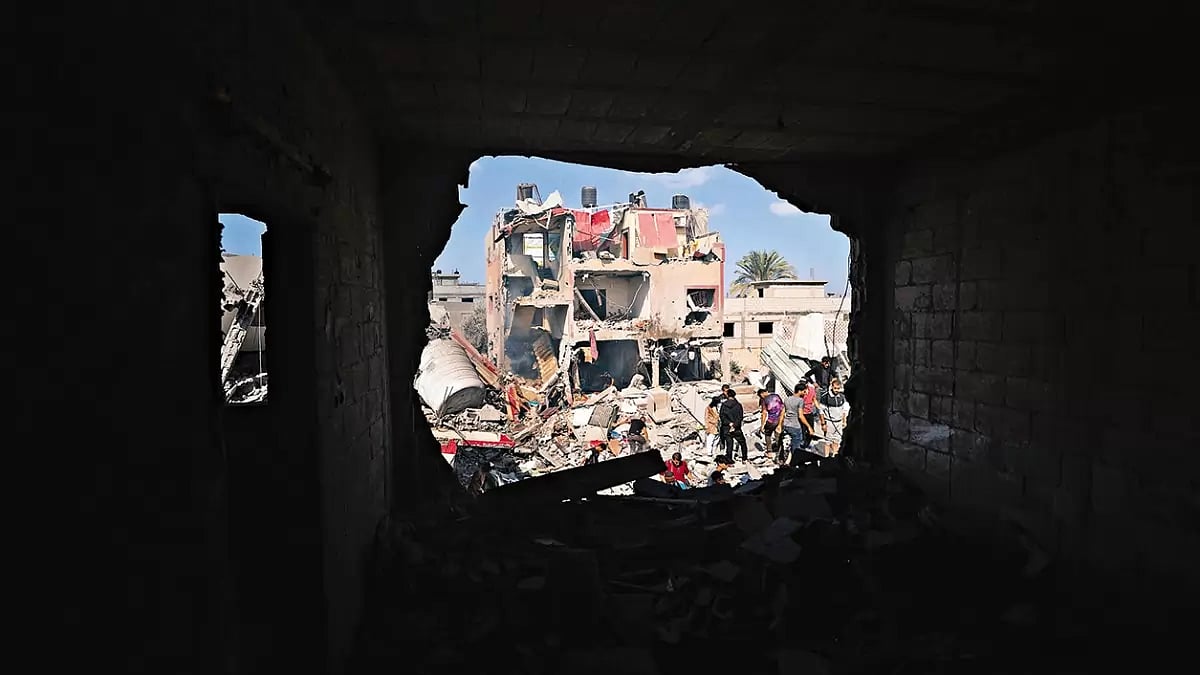 Reduced to Rubble: Civil defense teams and citizens conduct search and rescue operations after an Israeli airstrike hit a home in Khan Yunis, Gaza