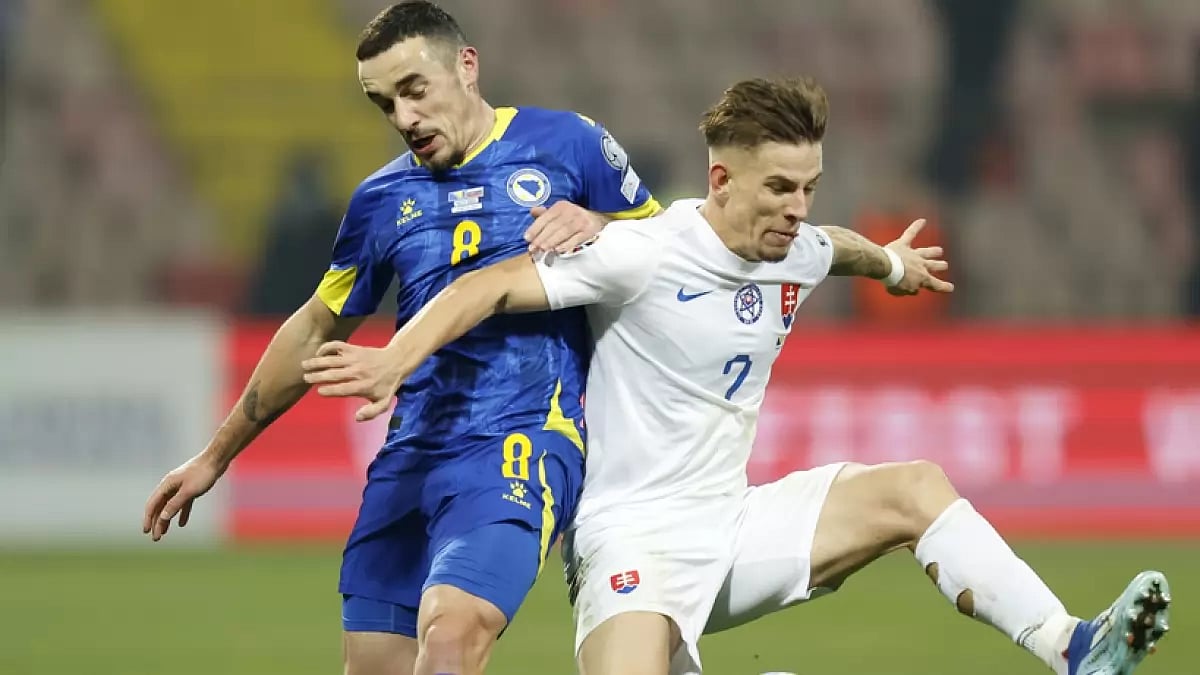 Bosnia's Ivan Basic (L) against Slovakia during the Euro 2024 match