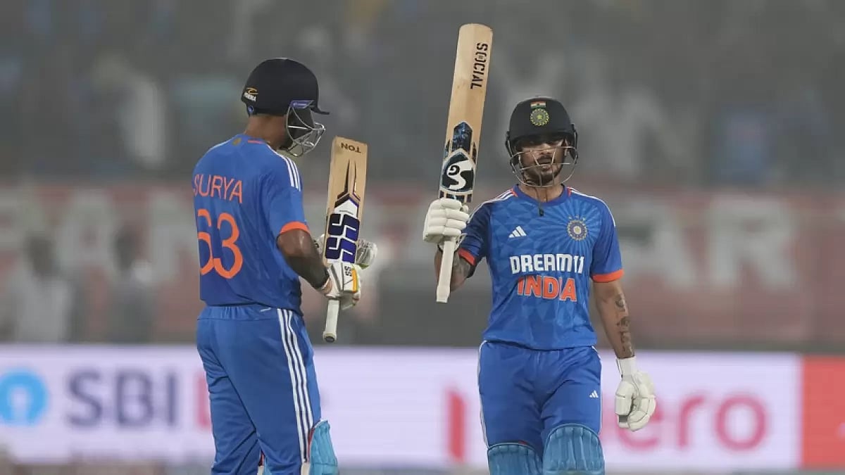 India's Ishan Kishan (R) celebrates his fifty against Australia during the first T20 cricket match