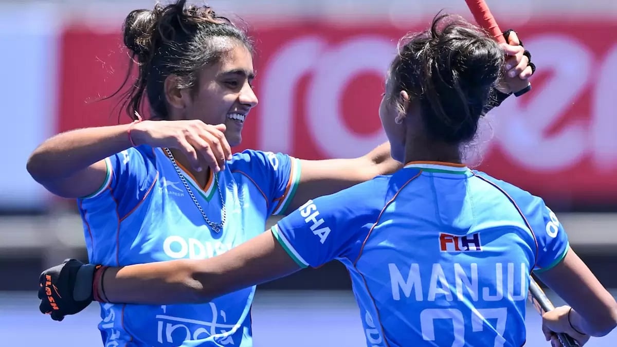 Indian junior women's hockey team players celebrate a goal