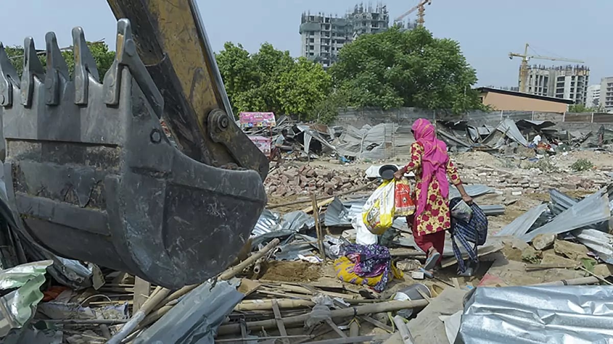 Residents of the Slums in Saraswati Kunj in Gurugram collect their belongings and prepare to move