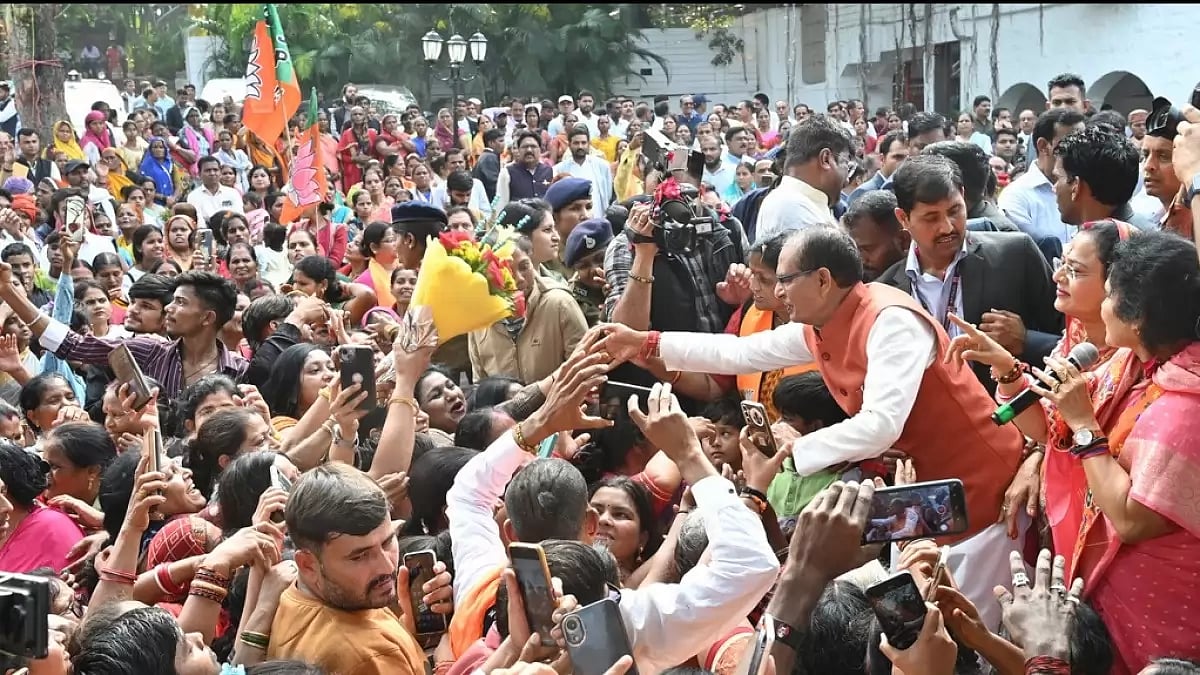 Chief Minister Shivraj Singh Chouhan greets supporters following BJPs lead in MP