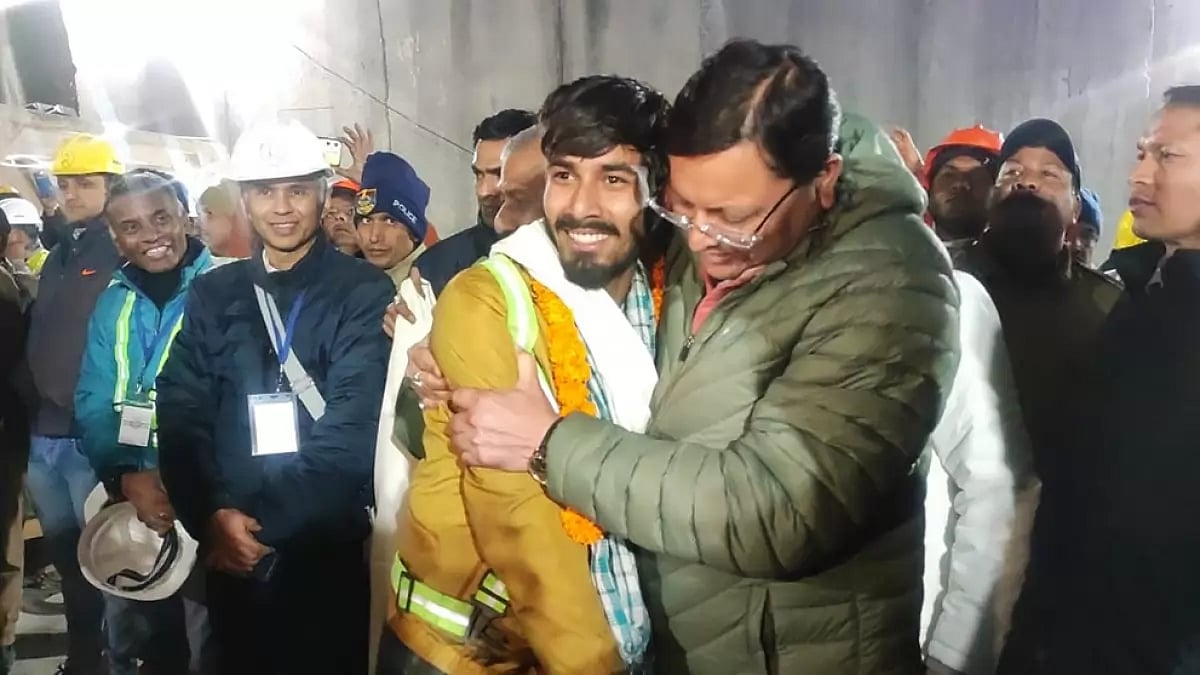 Pushkar Singh Dhami Chief Minister of the state of Uttarakhand, greeting a worker rescued