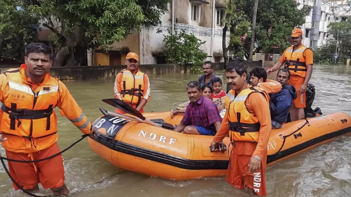 NDRF personnel evacuating residents in waterlogged areas in Kanchipuram