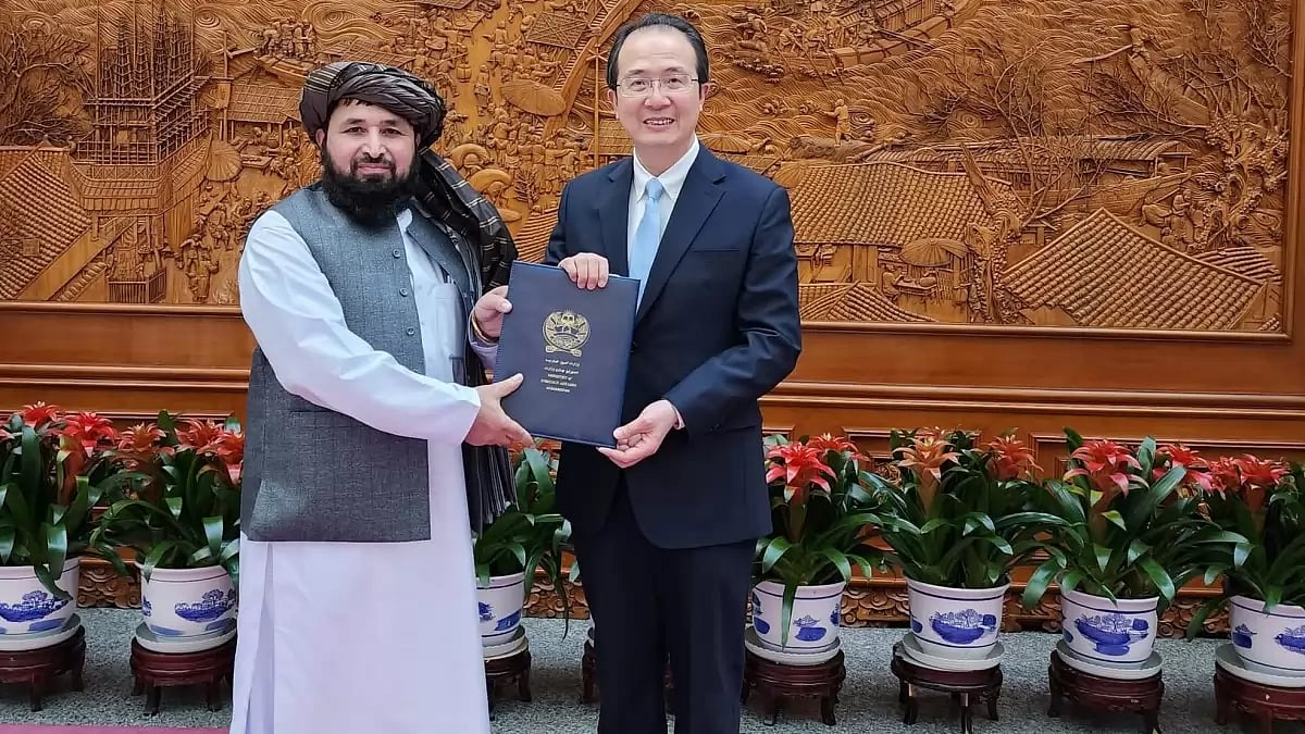 Taliban's envoy to China Bilal Karimi with Special Envoy on Afghan Affairs of China's Ministry of Fo