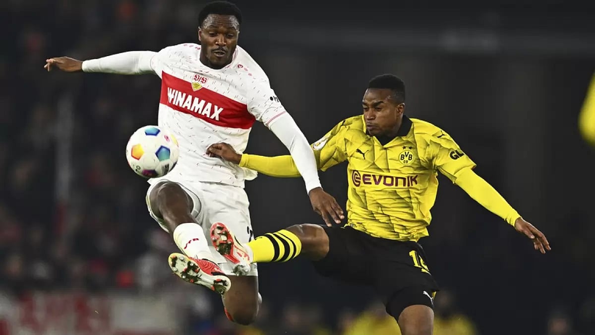 Stuttgart's Serhou Guirassy (L) vies for ball with Dortmund's Youssoufa during the German Cup