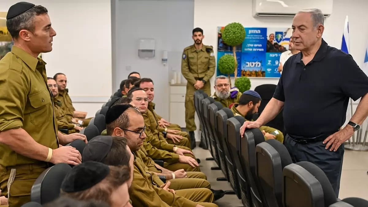 AP : Israeli Prime Minister Benjamin Netanyahu interacting with Israeli military personnel |