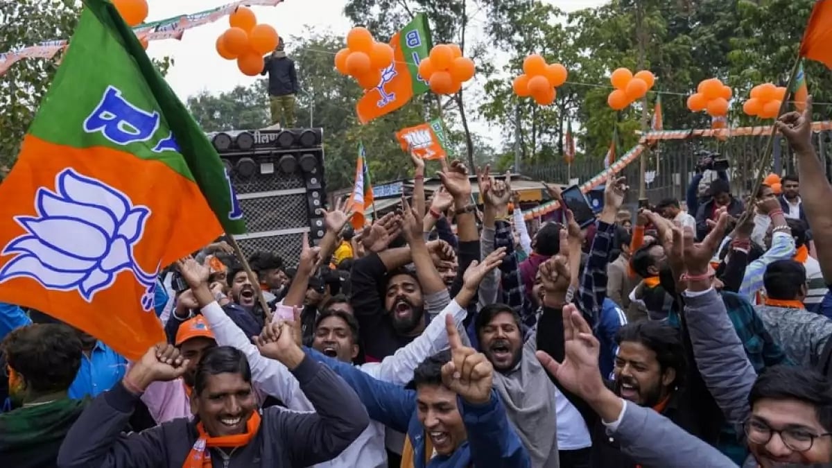 Supporters of India's ruling Bharatiya Janata Party, or BJP, celebrate early leads in state election