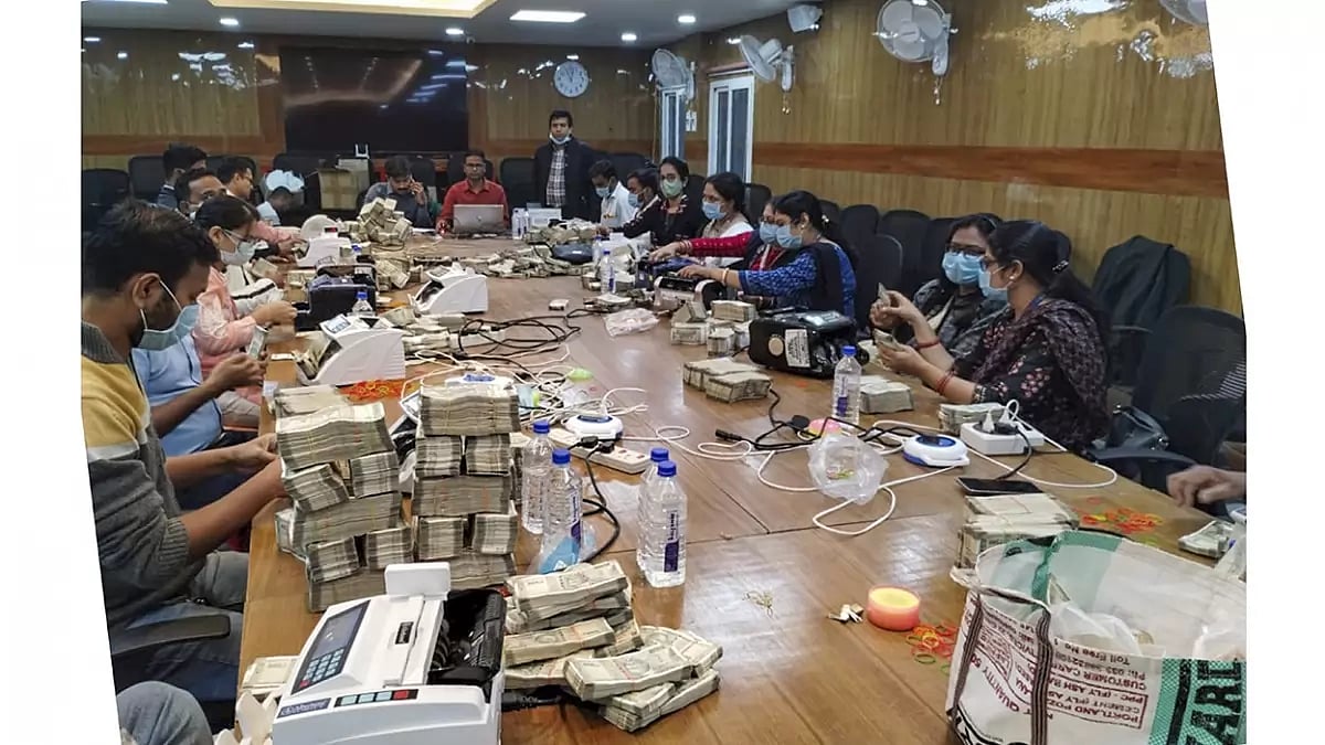 Counting of cash by officials after IT raids