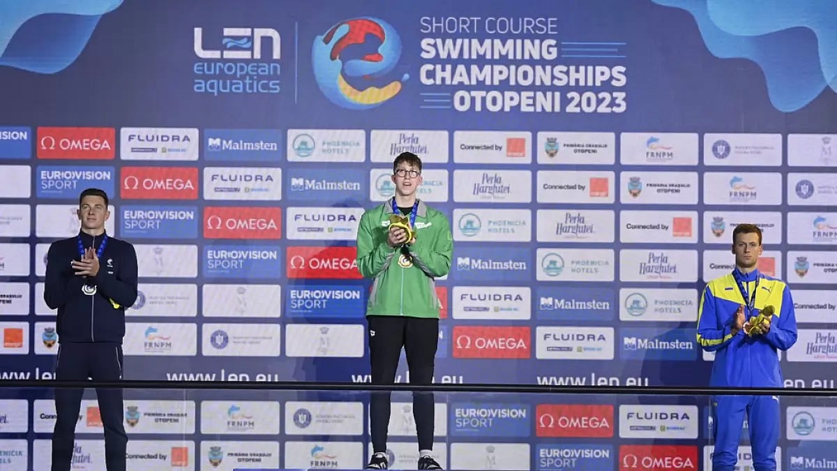Ireland's Daniel Wiffen, centre, celebrates his gold medal in Men's 800m Freestyle