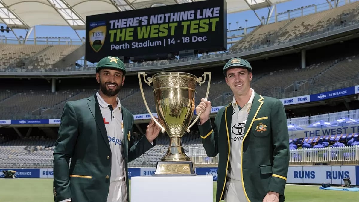 Pakistan skipper Shan Masood (left) poses with the trophy alongside Pat Cummins of Australia - null