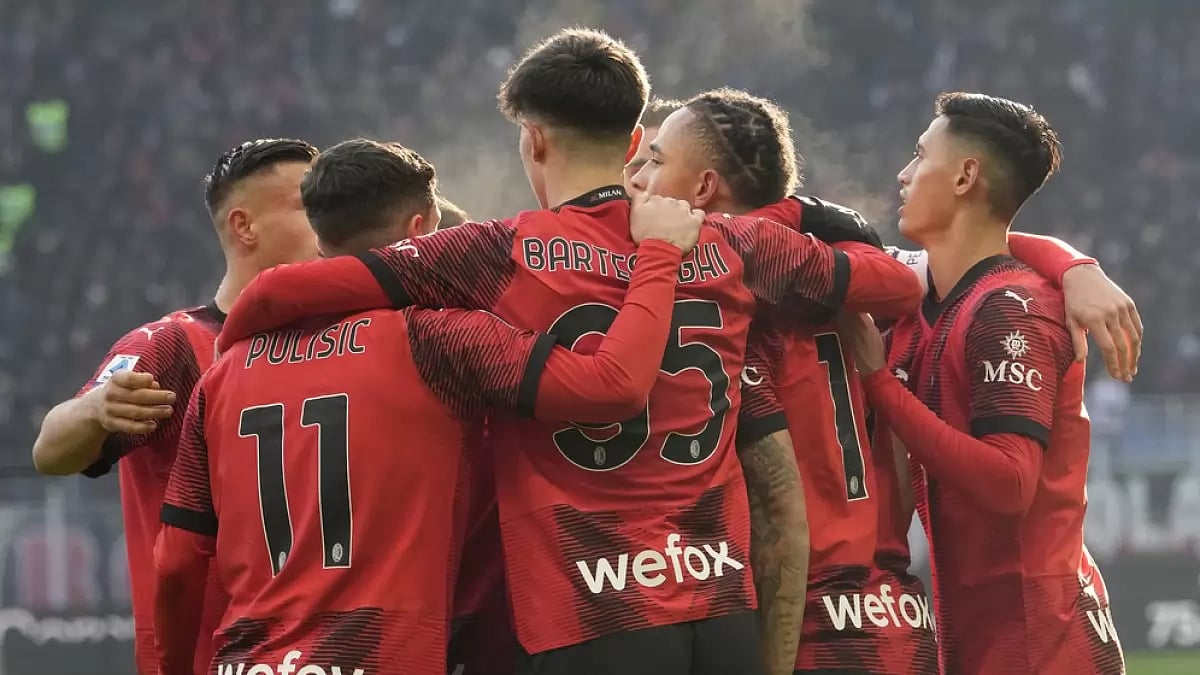 AC Milan players celebrate a goal against AC Monza