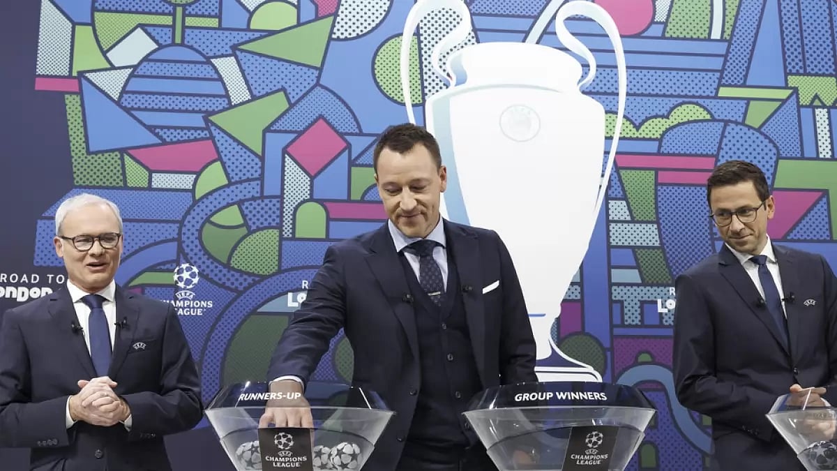 Former England captain John Terry (C) at the UEFA Champions League round of 16 draw in Switzerland. 