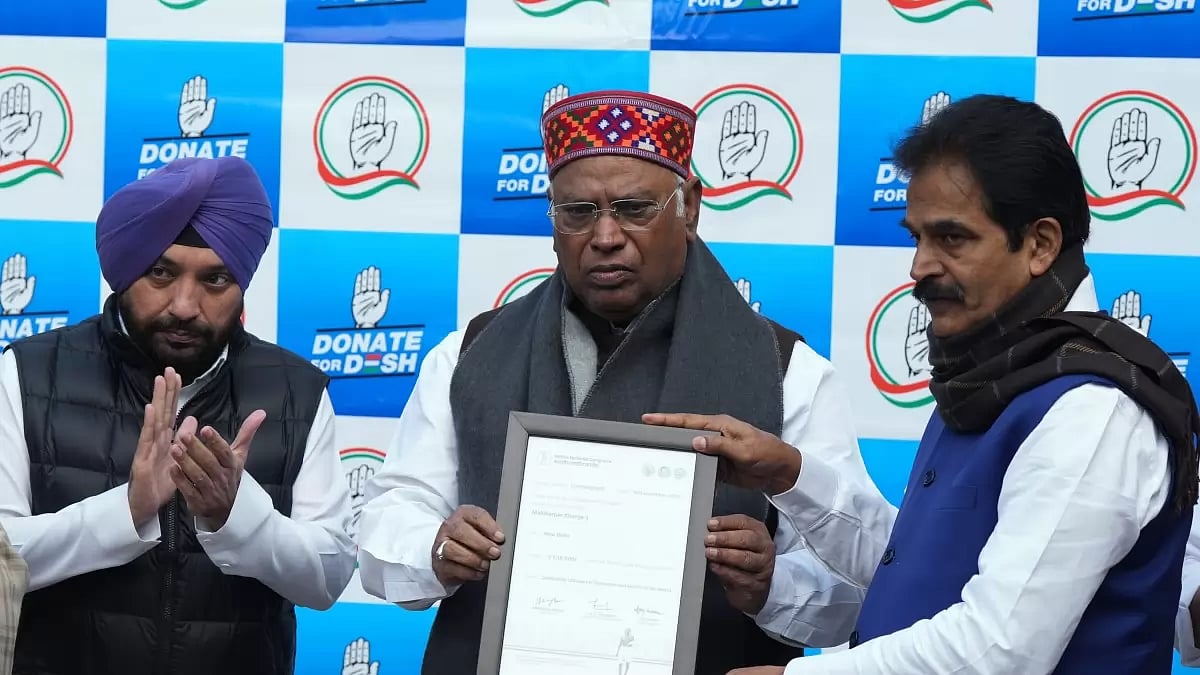 Congress President Mallikarjun Kharge with party leaders K.C. Venugopal and Arvinder Singh Lovely