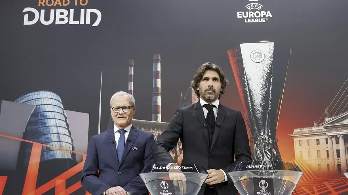 Former France footballer Julien Escude (R) at the UEFA Europa League draw in Switzerland. 
