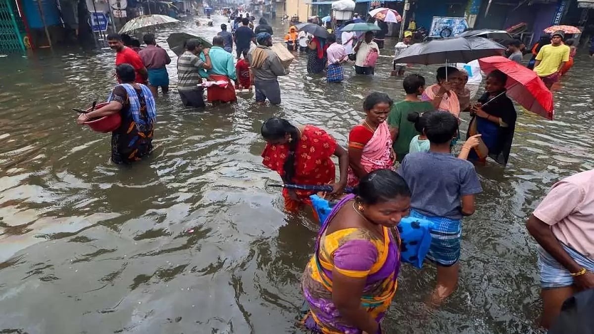 Chennai people wading through waterlogged area as heavy rainfall continues