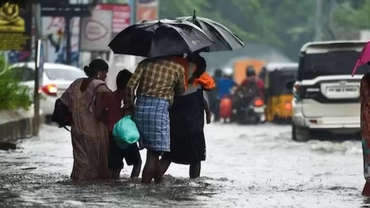 People wading through waterlogged streets in rain-hit  Tamil Nadu