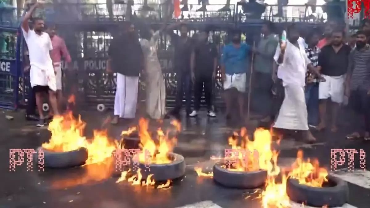 BJP Yuva Morcha workers burn tyres in protest in Thiruvananthapuram, Kerala against attack by DYFI.