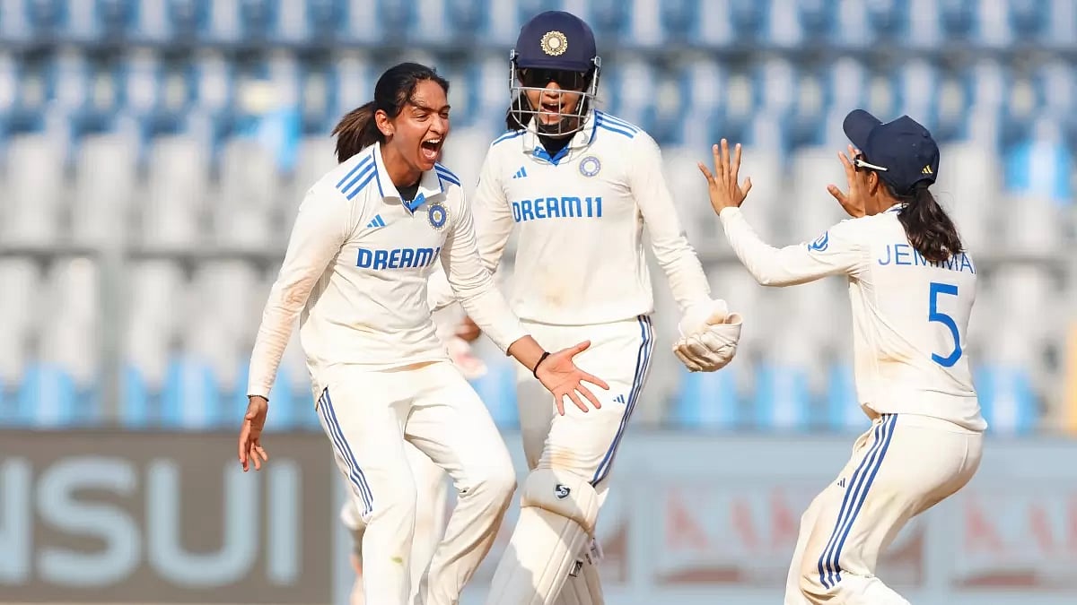 Harmanpreet Kaur (L) celebrates Tahlia McGrath's wicket in the India vs Australia Test.