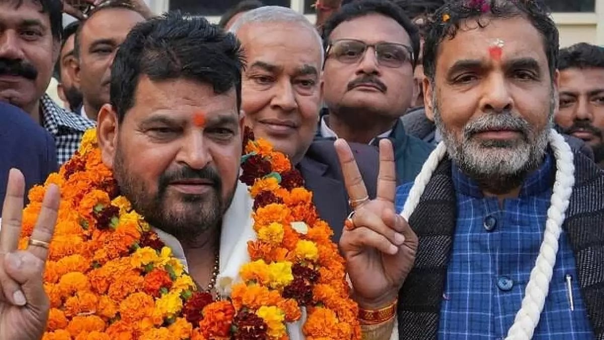 Sanjay Singh (right) with Brij Bhushan Sharan Singh (left)