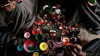 Christmas In Another World Kashmiri Muslim artisans paint the final touches to products before sending them for Christmas