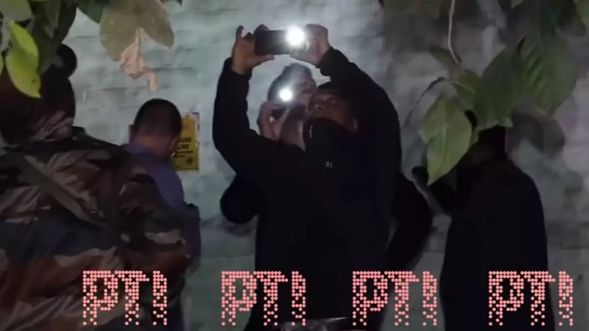 Israel Embassy's security team inspects the area near the embassy in New Delhi.