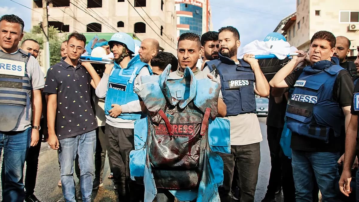 Scribes Take a Hit: Friends carry bodies of Palestinian journalists Muhammad Sobh and Saeed Al-Taweel