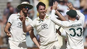 Australian players celebrate a wicket on day 2 of the MCG Test