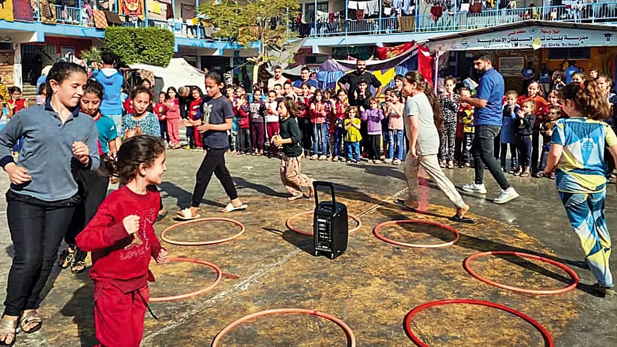A Brief Respite: Children living in a camp for displaced Palestinians participate in a group activit