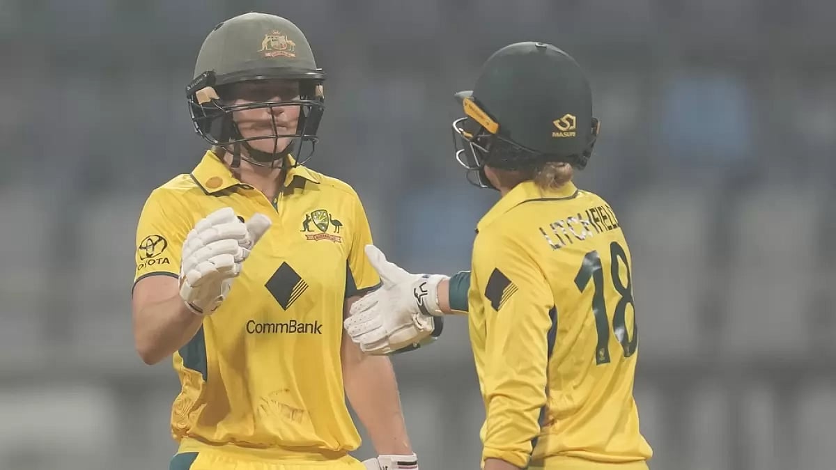 Ellyse Perry (L) celebrates her fifty with Phoebe Litchfield during the India vs Australia ODI ODI i