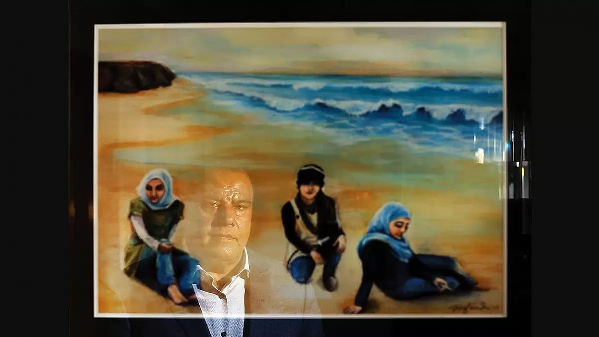 Living Images: Izzeldin Abuelaish looks at a painting of his three dead daughters