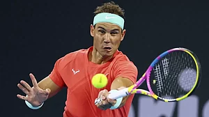 Rafael Nadal hits a return against Dominic Thiem during the Brisbane International tennis tournament