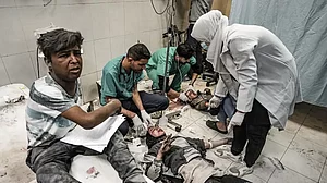 Injured Palestinian people, including children as a result of Israeli attacks are taken to the Nasser Hospital for a treatment as Israeli attacks continue in Khan Yunis, Gaza