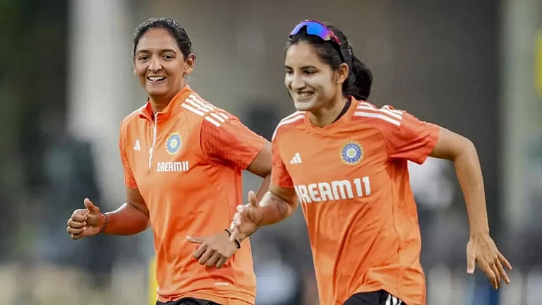 India women's team captain Harmanpreet Kaur (L) with Renuka Singh (R) in training - null