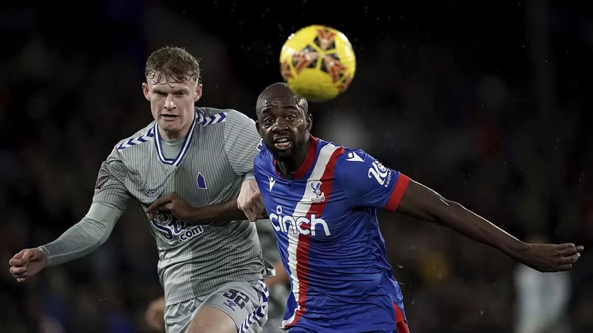 Jarrad Branthwaite, left and Jean-Philippe Mateta vie for the ball, during the English FA Cup third round football match between Crystal Palace and Everton at Selhurst Park, London.