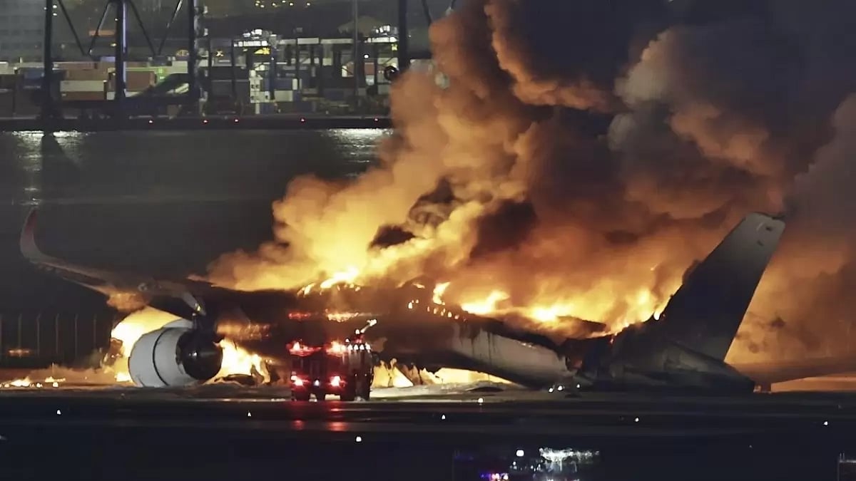 A Japan Airlines flight caught fire after a collision at Tokyo's Haneda Airport on January 2 - null
