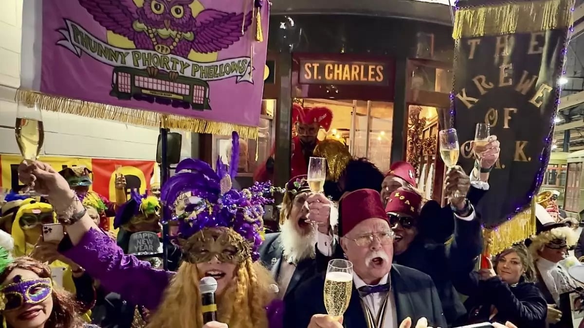 The Phunny Phorty Phellows and the Krewe of Oak toast as they kick-off Carnival season. 