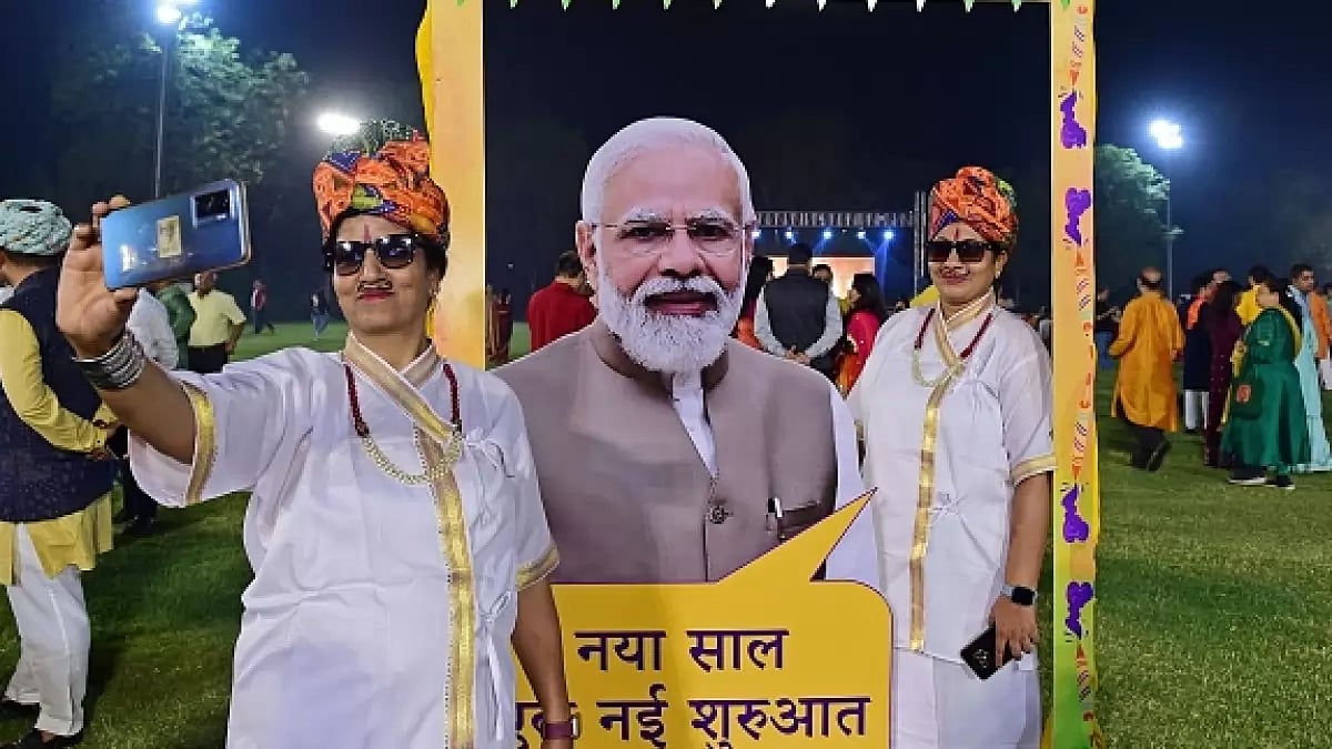 Women take their selfie with a cut-out of Indias Prime Minister Narendra Modi 
