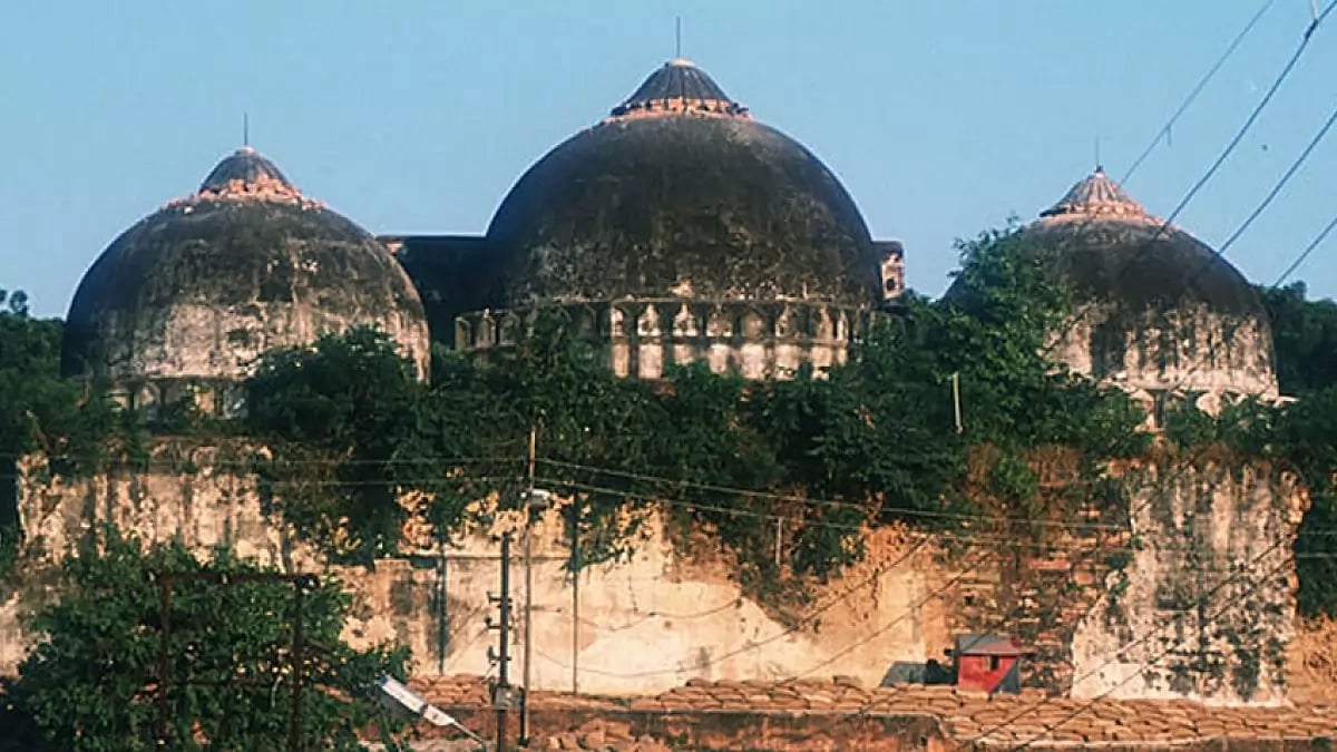 Members of a border security force guard a mosque from attack by militant Hindus October 29, 1990