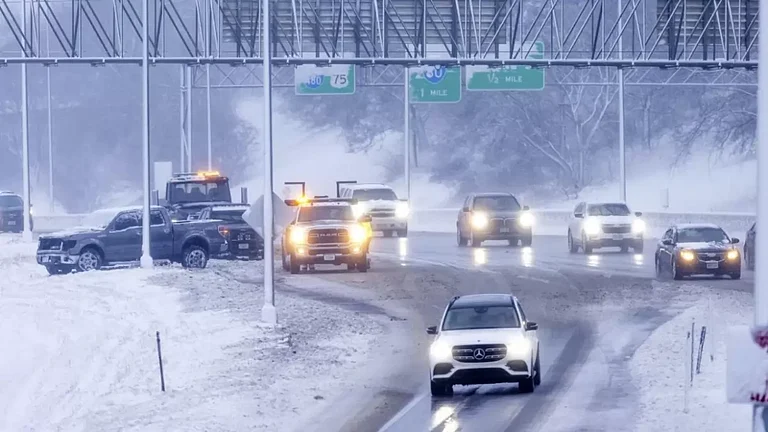 Omaha police and a tow truck respond to an accident. - null