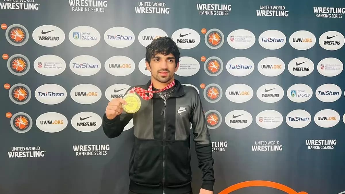 Aman Sehrawat celebrates his gold medal victory at the Zagreb Open 2024 wrestling competition.