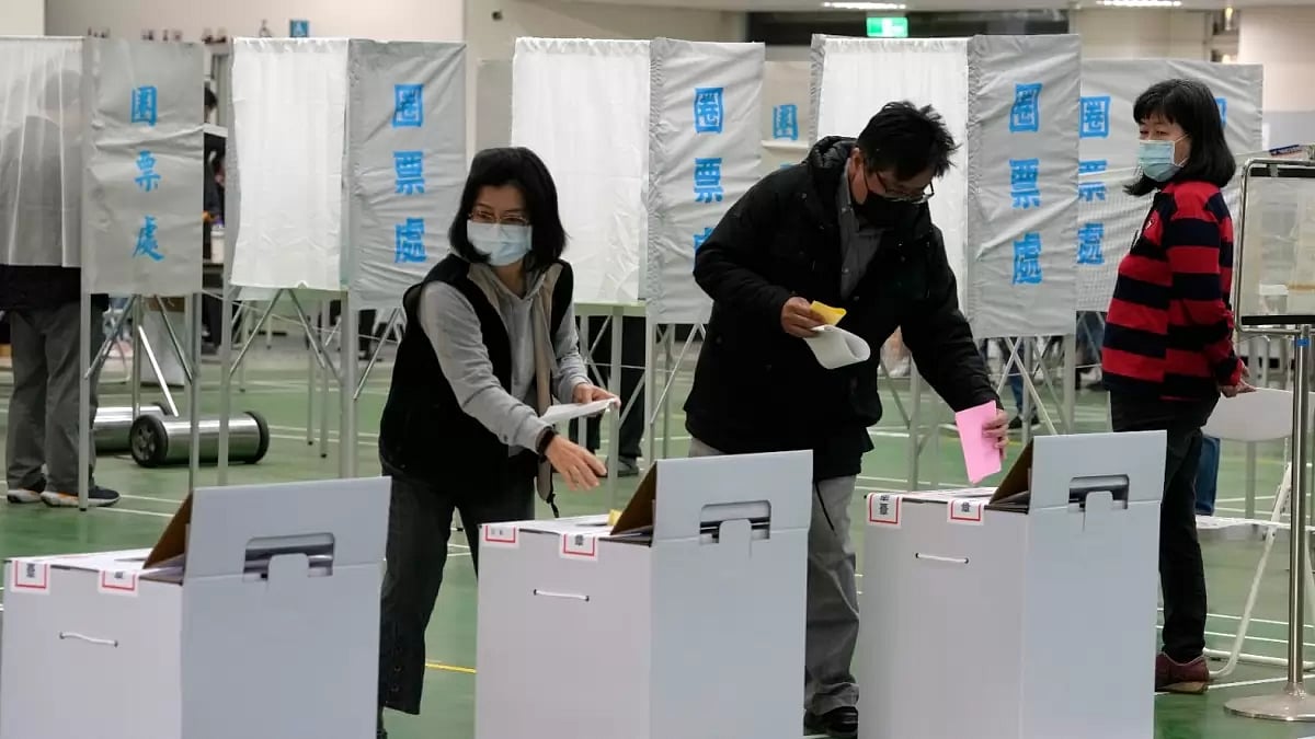 People vote for the presidential election at a polling station in southern Taiwan's Tainan city on Saturday