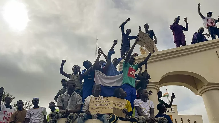 Supporters of Nigers ruling junta gather at the start of a protest called to fight for the countrys freedom and push back against foreign interference in Niamey, Niger. The march falls on the West African nations independence day from its former colonial ruler, France, and as anti-French sentiment spikes, more than one week after mutinous soldiers ousted the countrys democratically elected president. - null