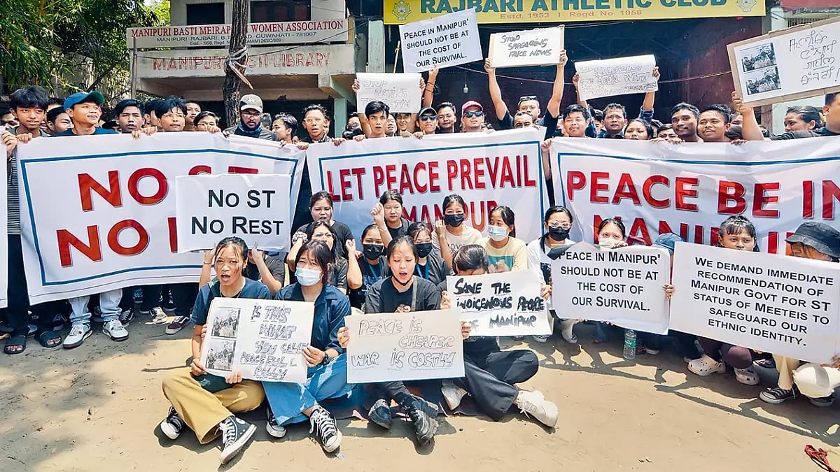 Twin Issues: People stage a protest against the violence in Manipur