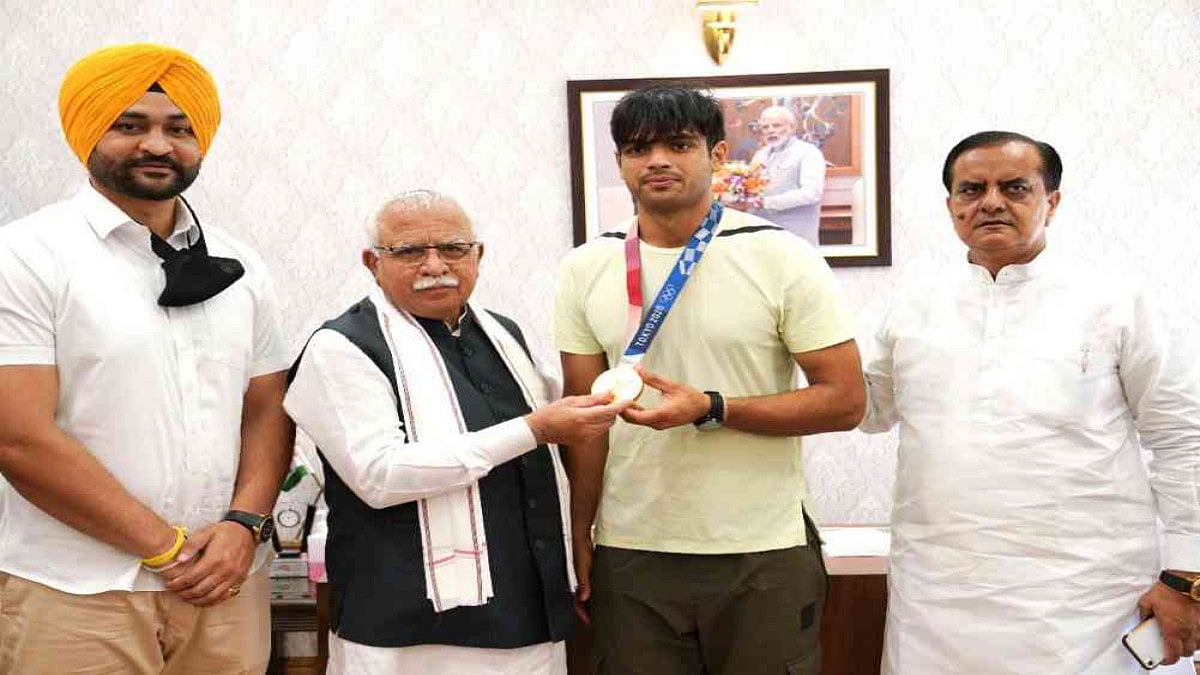 Olympic gold medallist Neeraj Chopra along with Haryana CM Manohar Lal Khattar and sports minister Sandeep Singh.