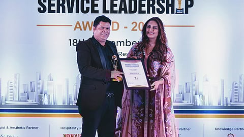 Dr Inderjeet Singh Gautam receiving an award from Huma Qureshi.
