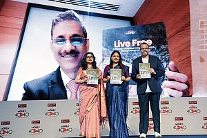 (L-R) V. Vaidyanathan (on screen), MD and CEO, IDFC FIRST Bank, Nidhi Sinha, Editor, Outlook Money; Shikha Hora Kamdar, Head - Retail Assets, IDFC FIRST Bank; and Indranil Roy, CEO, Outlook Group, launch of Live Free, A Directory of Assisted Living, Care Homes, Old Age Homes In India, powered by Elderly Care India and presented by IDFC FIRST Bank, at the event on February 20, 2026 in Mumbai.
